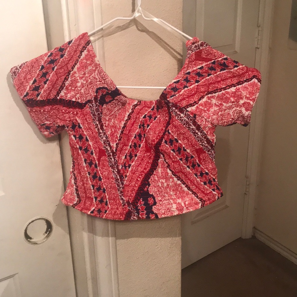 Off the shoulder crop top with ruffle sleeves .